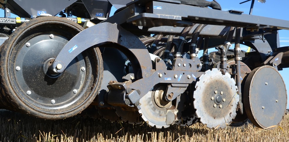 The Sky Easy Drill has a rubber Otico packer roller in front of the coulter disc with skim coulter and following steel press wheels that close the slot.